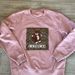 - Coach Pink Crewneck Sweater with Graphic Design